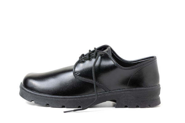 Black school shoe on white background