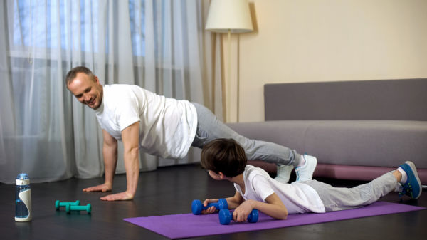 Family doing the plank and exercise at home